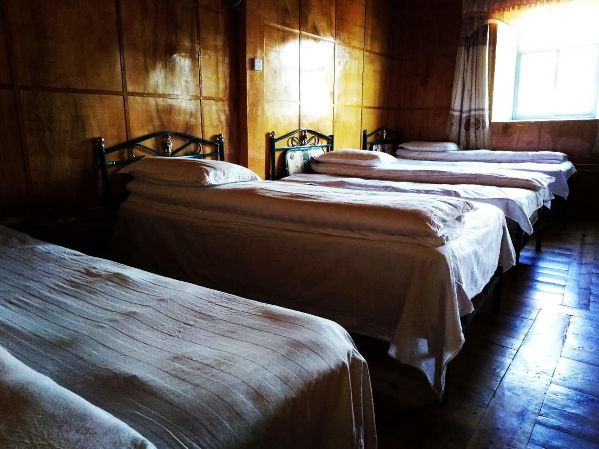 Zishuo Zihua Guest House Daocheng Exterior photo