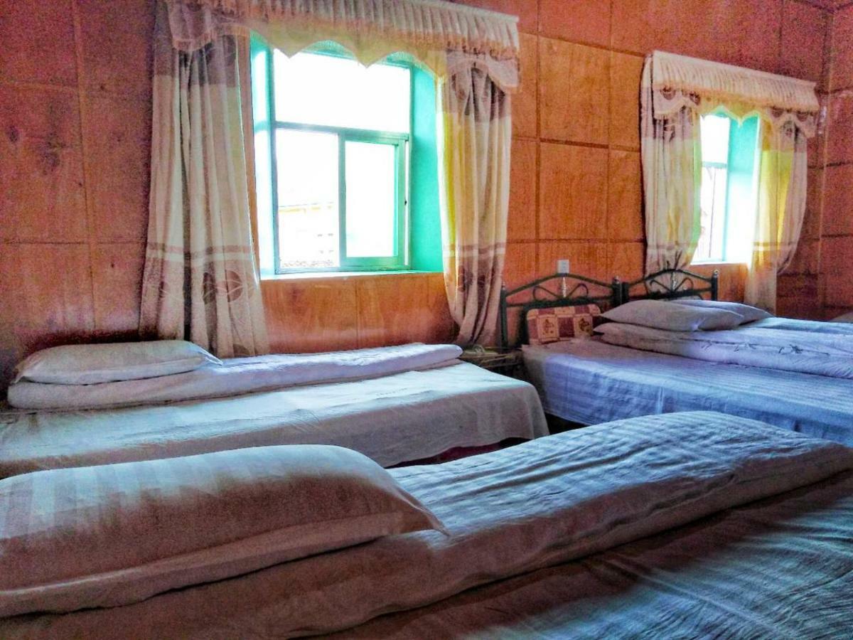 Zishuo Zihua Guest House Daocheng Exterior photo